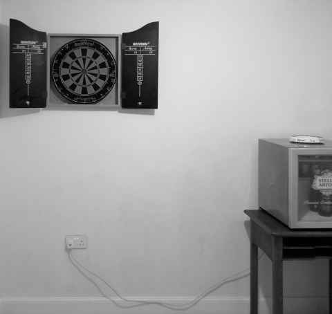 Straightened image of the newly painted study, still showing dartboard and beer friege
