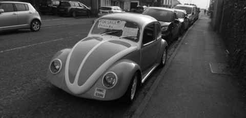 quite nice beetle that is parked up down the road and for sale
