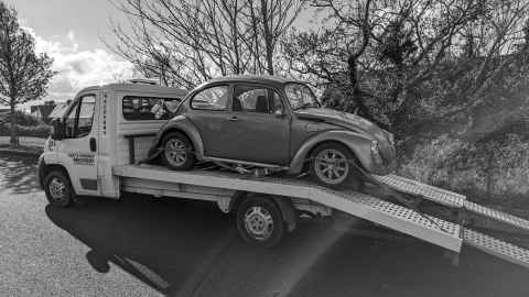 Beetle on the back of a recovery truck