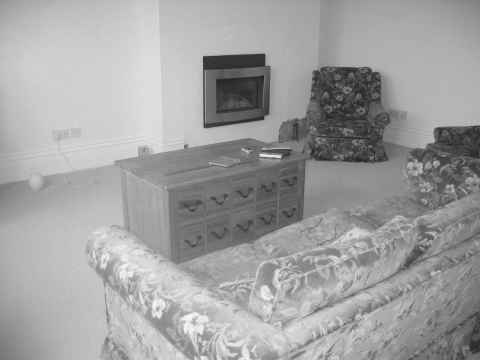 The lounge in Earls Avenue decorated, but with the second hand sofa
