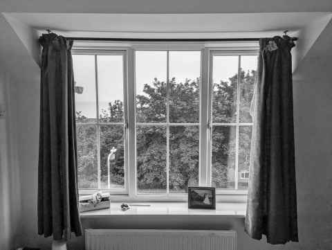 Before, the ragged red curtains