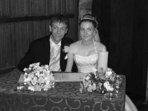 Clare and I signing the wedding register