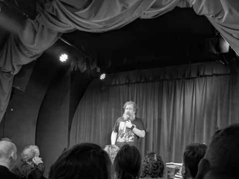 Nick Helm on stage at the tiny Museum Of Comedy