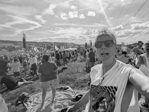 Me at Glastonbury 2025 wearing the Senseless Things t-shirt I got in 1990